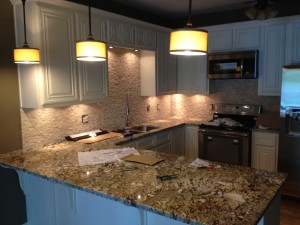 Under cabinet lighting and pendant lights.